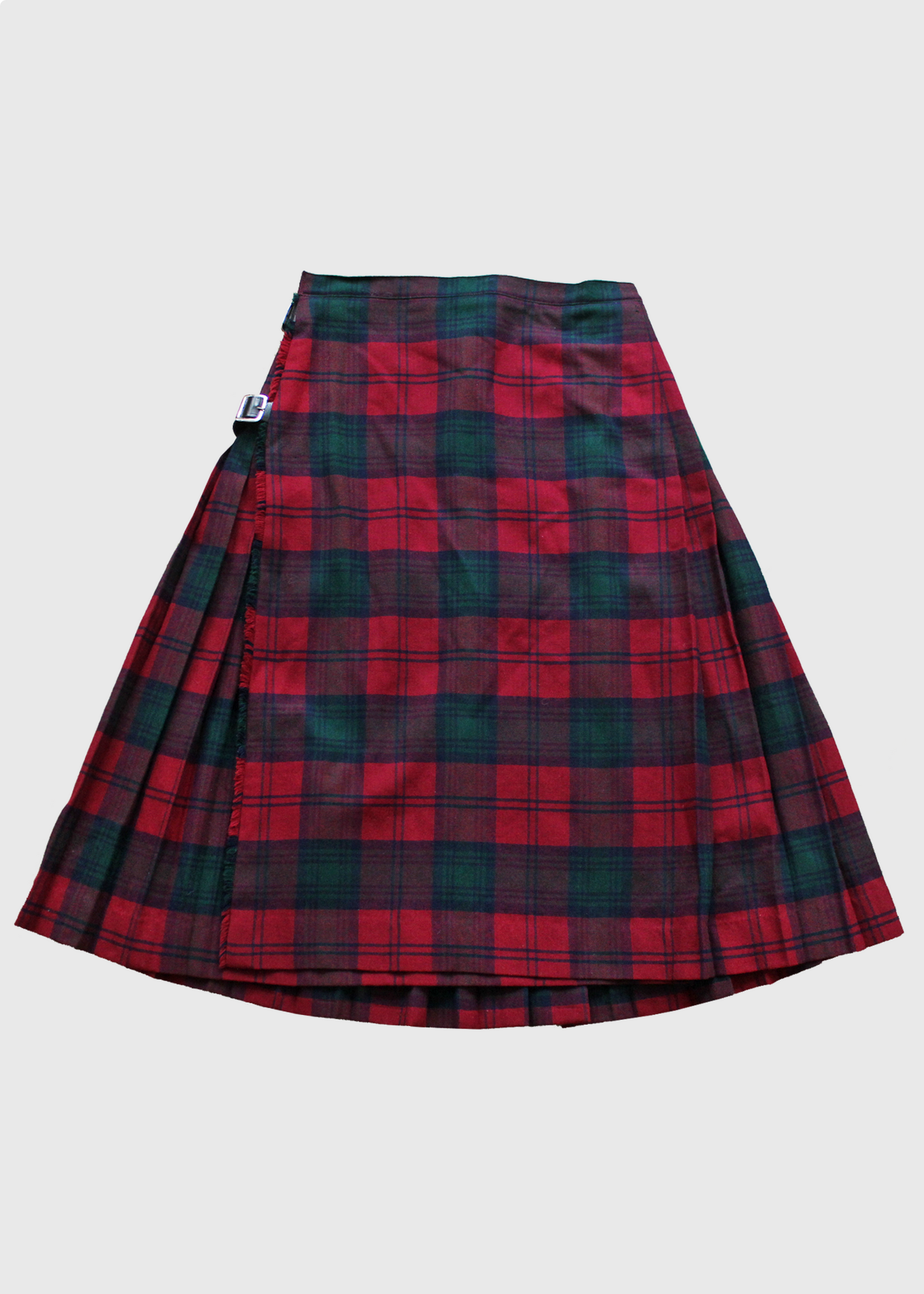 A back view of the Vintage 1980s pleated plaid skirt by Burberry, made in Scotland from soft 100% wool. Red/blue/green tartan plaid with real leather double buckle detail.
