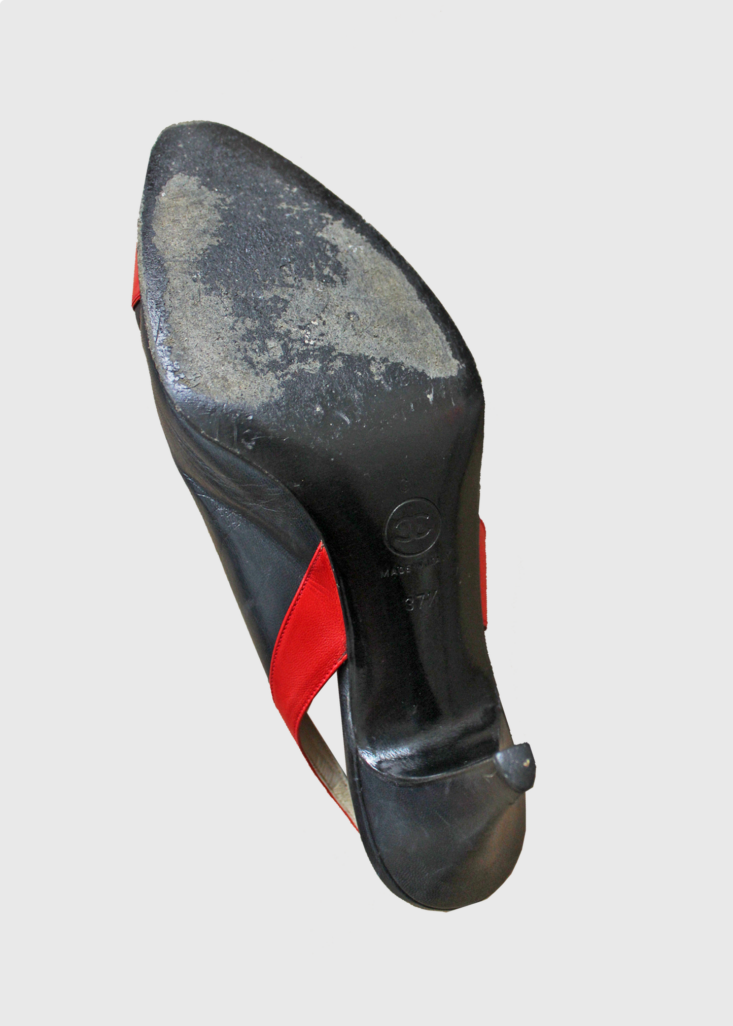 Deep blue and bright red leather slingback heels by Chanel with gold clasp hardware on the outside slingback ankle strap.