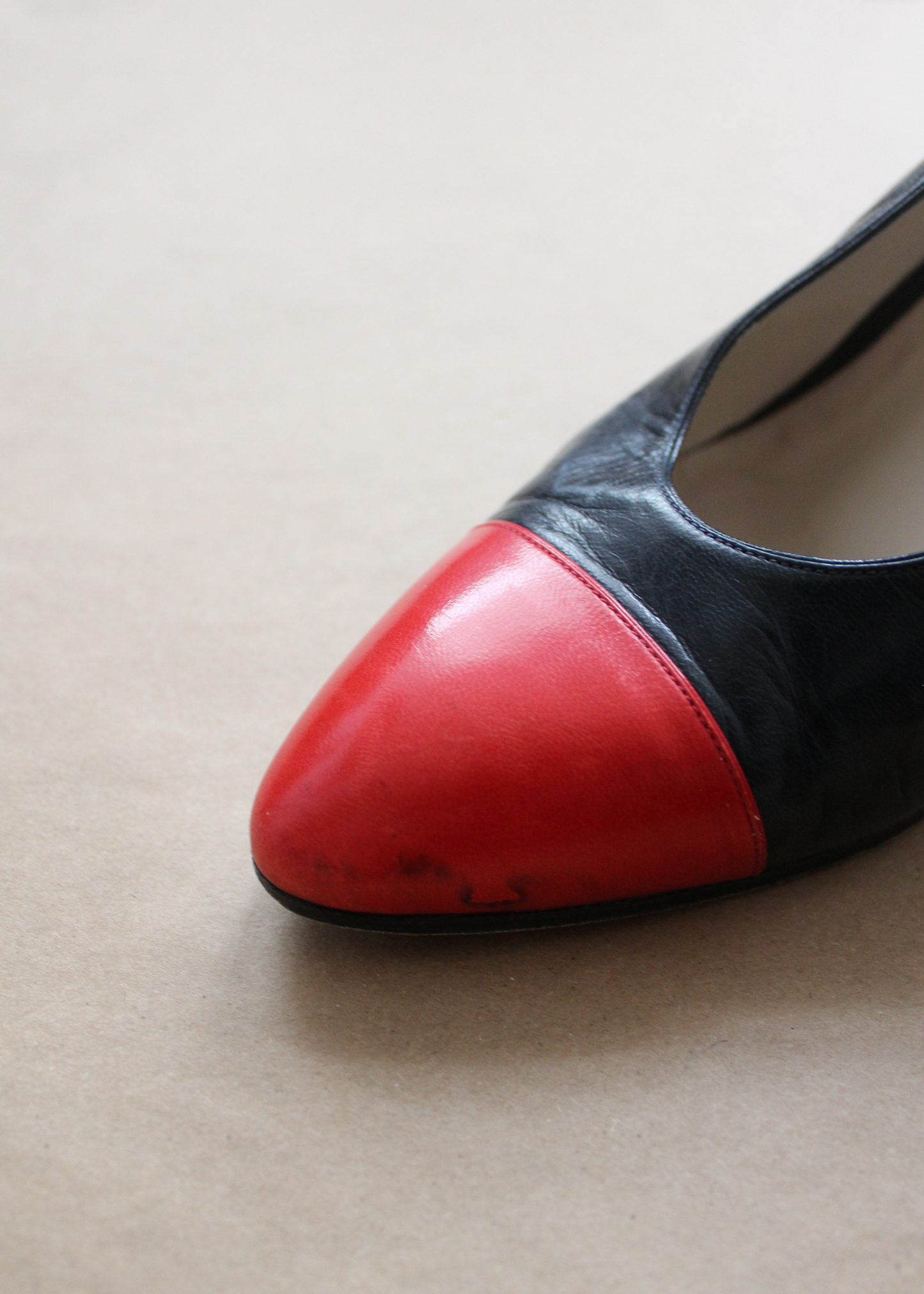 Deep blue and bright red leather slingback heels by Chanel with gold clasp hardware on the outside slingback ankle strap.