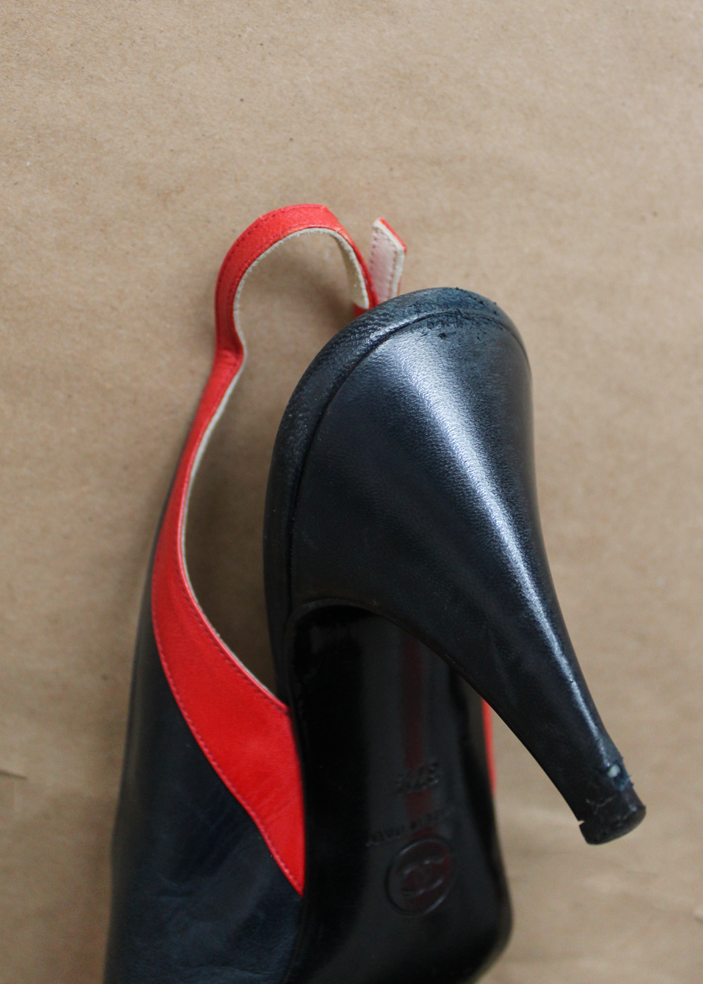 Deep blue and bright red leather slingback heels by Chanel with gold clasp hardware on the outside slingback ankle strap.